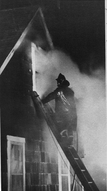 From the Archives: Nicol Fire on Bayside Ave. (now Brightman Way).  From the Westerly Sun 3/26/73 by John Koulbanis.  Caption:  &quot;A fireman struggles at the second floor window of the A. Norman Nicol home while efforts were being made to bring out the three young girls who were trapped inside.  Only one was brought our alive, but she died soon after.&quot;